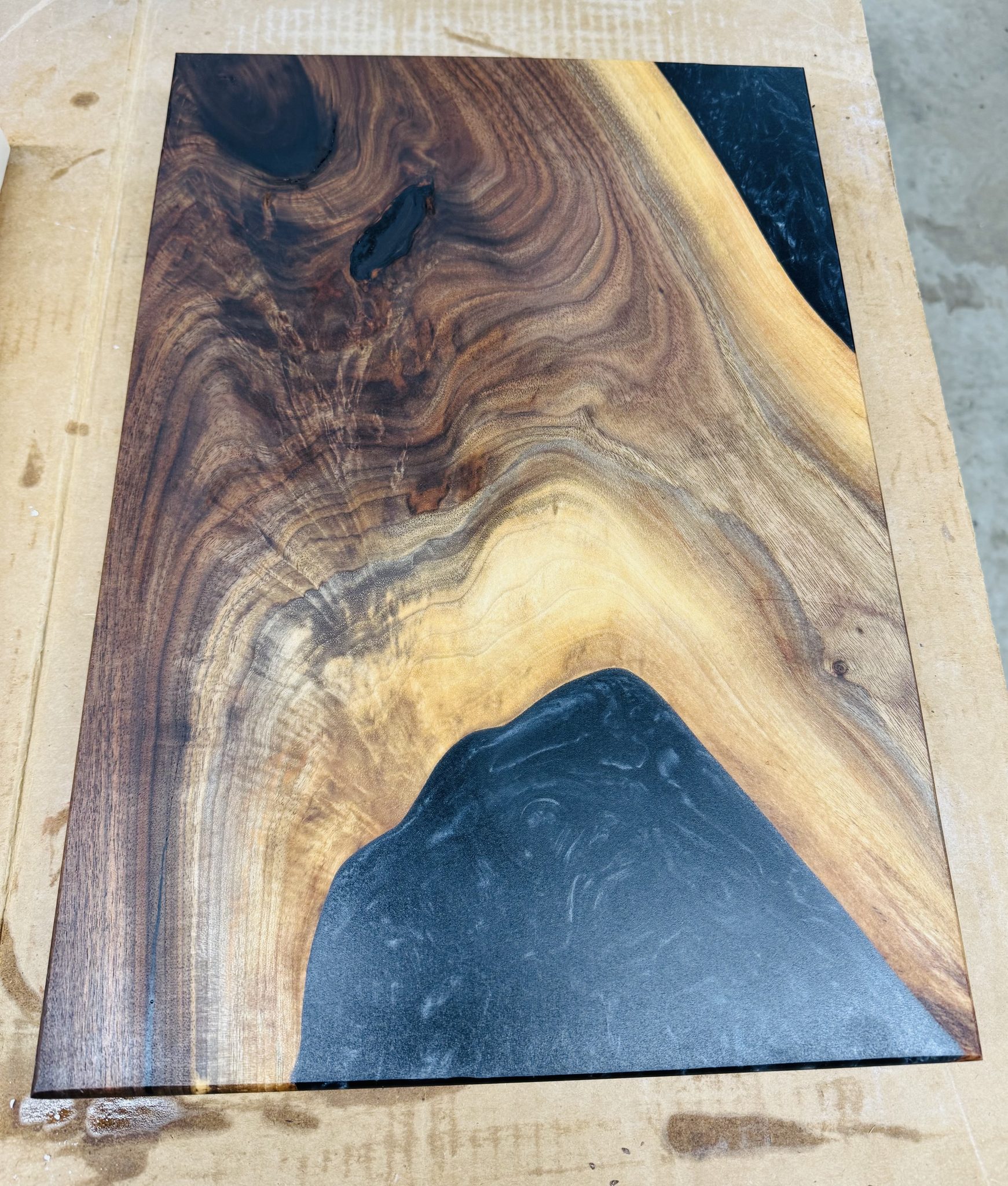 Walnut slab with blue epoxy river