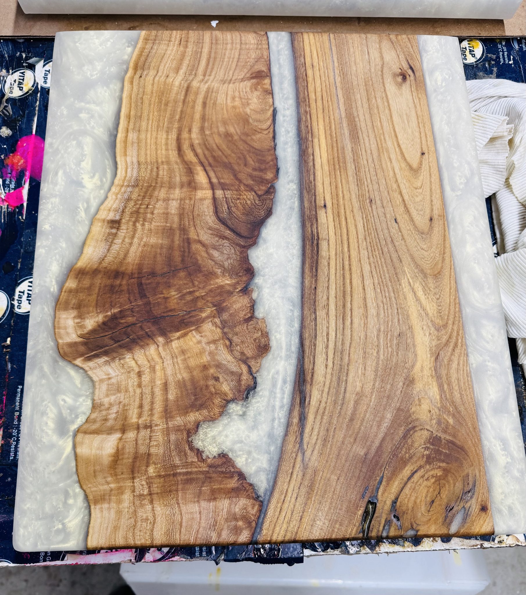 Walnut table with white epoxy river