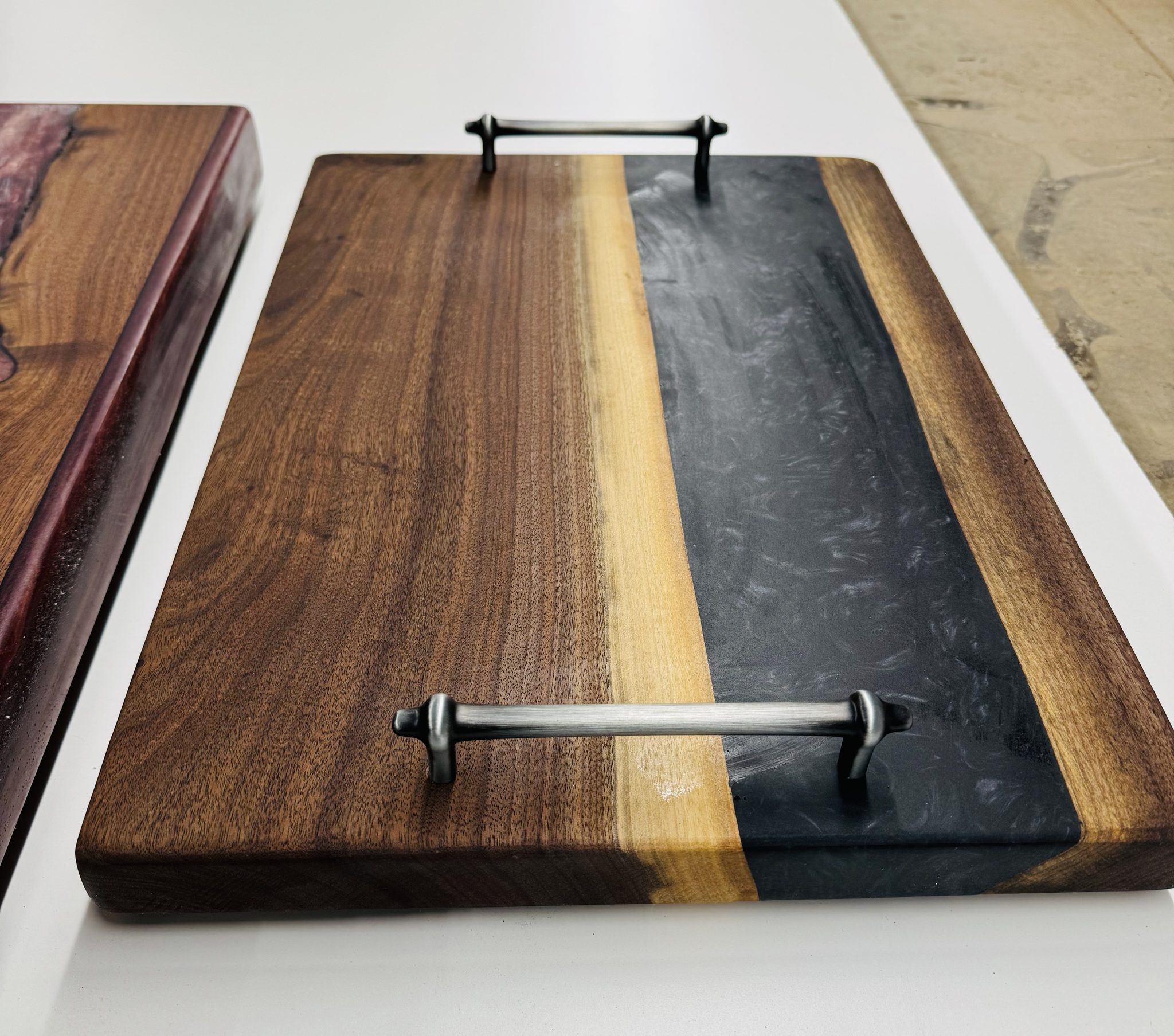 Walnut serving board with iron handles