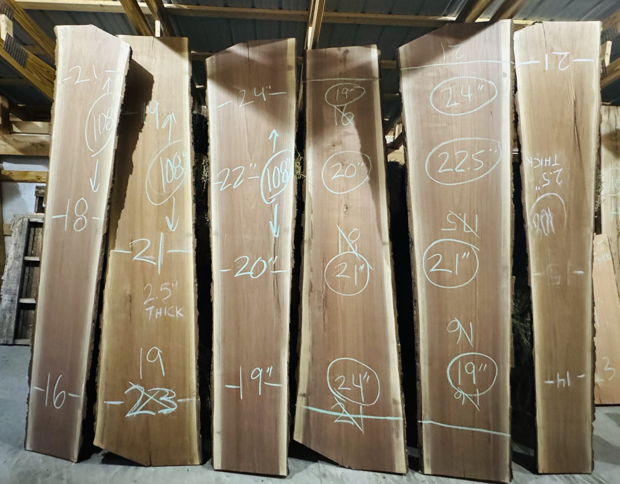 Live edge slabs marked for cutting
