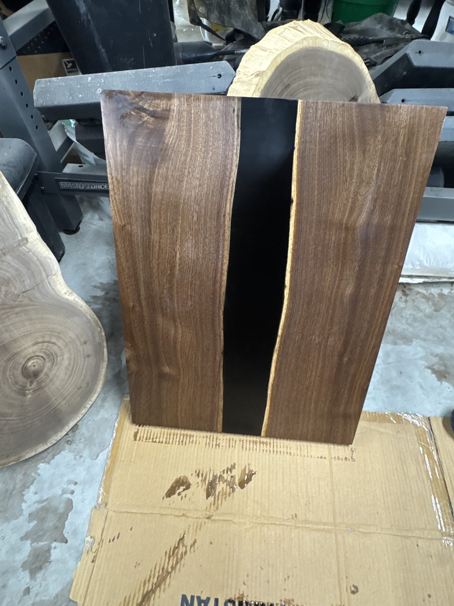 Walnut epoxy river table with black resin